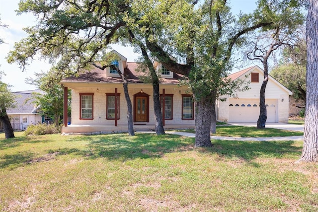 view of front of property featuring a front yard, a porch, and a garage