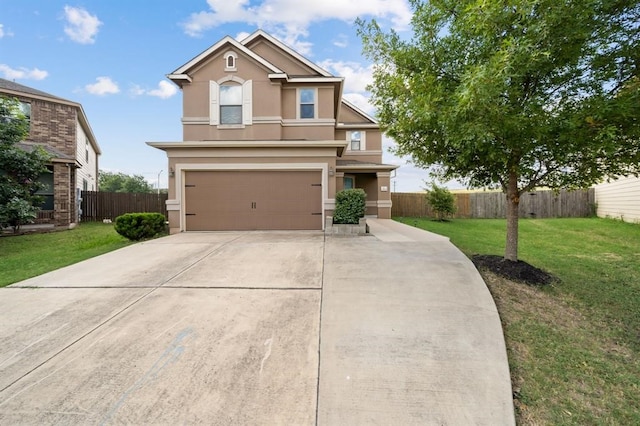 view of front of property featuring a front yard and a garage