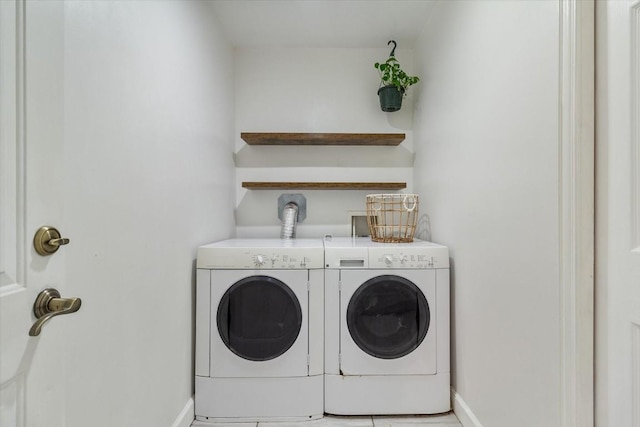 washroom with washer and dryer