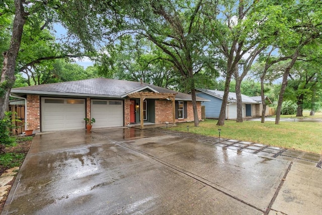 ranch-style home featuring a garage and a front lawn