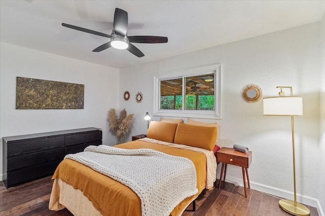 bedroom featuring ceiling fan and dark wood-type flooring