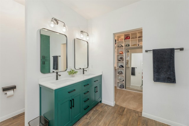 bathroom featuring vanity and wood-type flooring