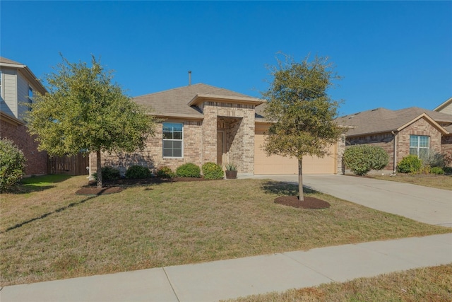 view of front of property with a garage and a front lawn