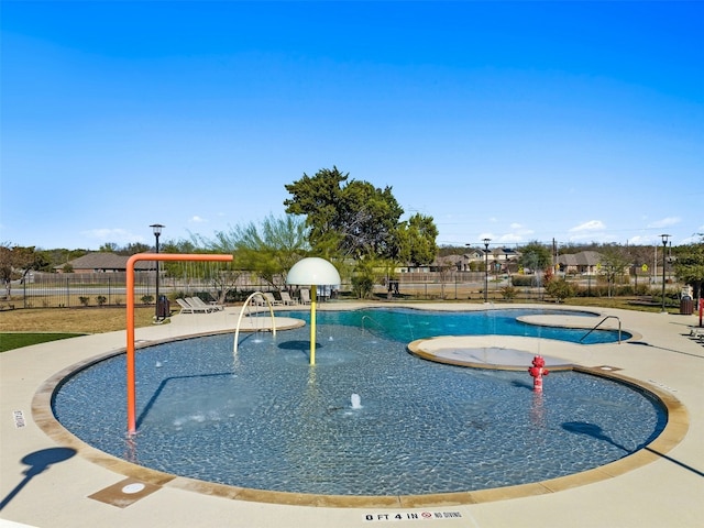 view of swimming pool featuring pool water feature