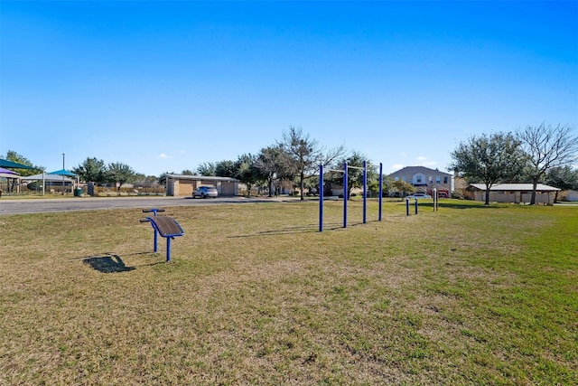 view of home's community with a yard