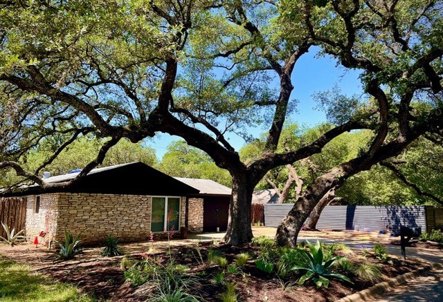 309 Rowland Dr, Austin, TX 78745 - view of front of home featuring stone siding