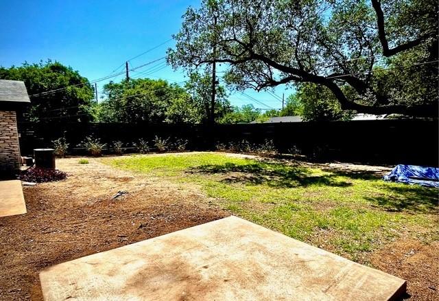 309 Rowland Dr, Austin, TX 78745 - fenced backyard with a patio area