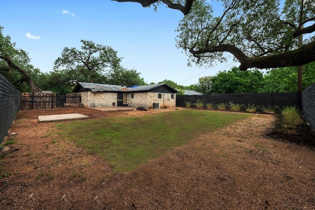 309 Rowland Dr, Austin, TX 78745 - fenced backyard featuring a patio area