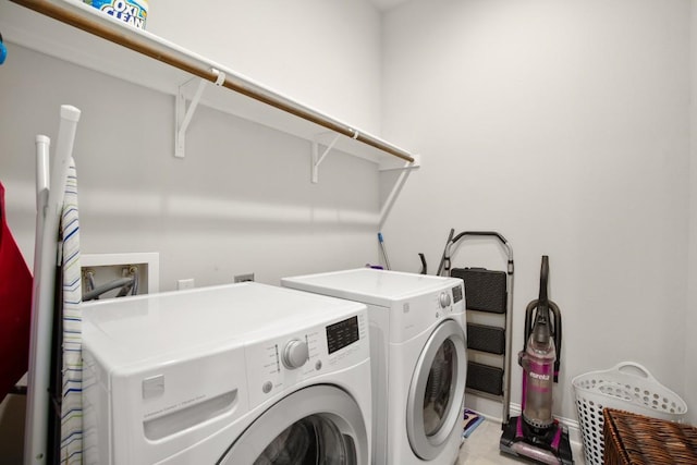 washroom with washer and dryer