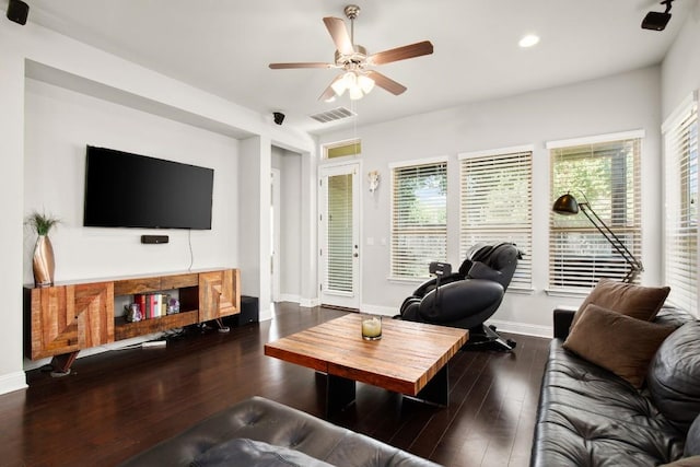 living room with ceiling fan and dark hardwood / wood-style floors