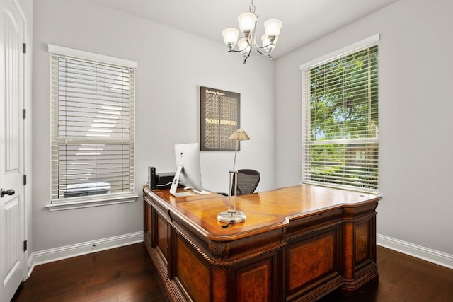 office area with dark hardwood / wood-style flooring and a chandelier