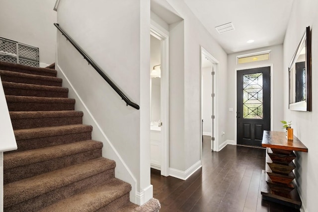 foyer with dark hardwood / wood-style flooring