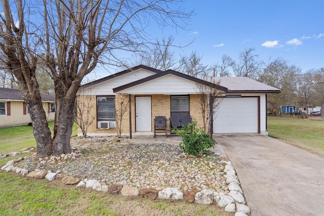 ranch-style house featuring covered porch, cooling unit, a garage, and a front lawn