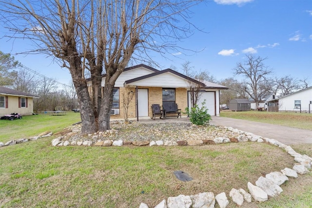 ranch-style home featuring a front yard and a garage