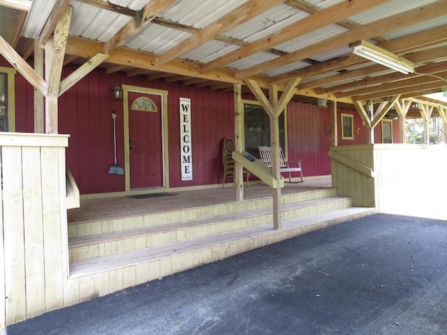 entrance to property featuring covered porch