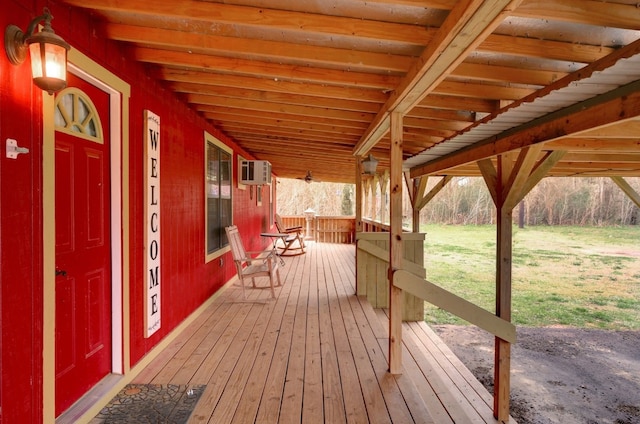 wooden terrace featuring covered porch