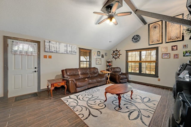 living room with ceiling fan, lofted ceiling with beams, and a textured ceiling