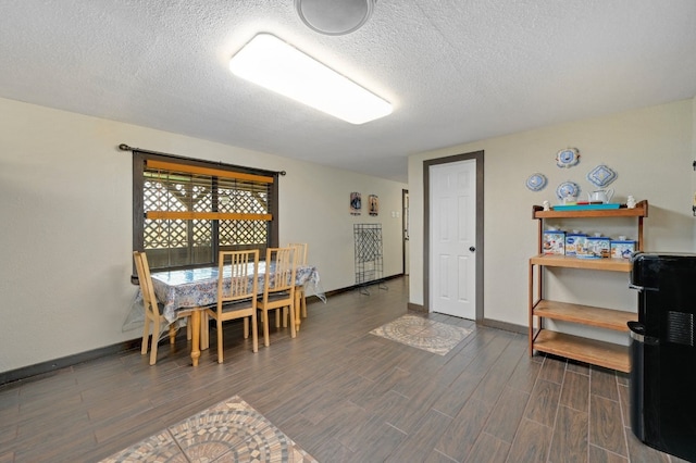 dining space with a textured ceiling