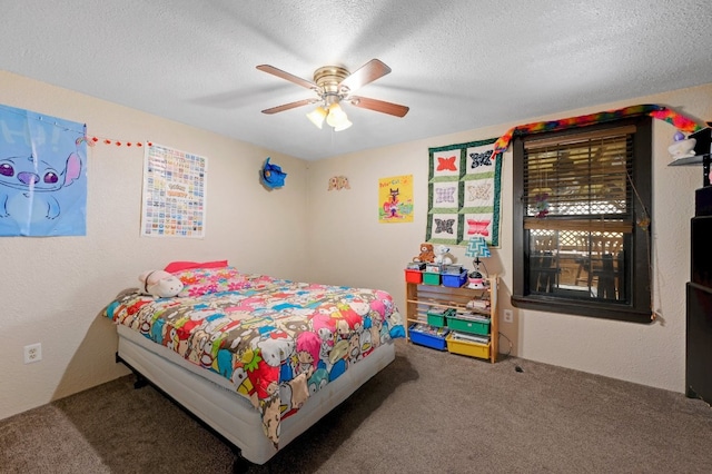 carpeted bedroom with a textured ceiling and ceiling fan