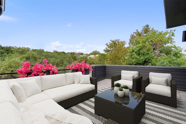 view of patio featuring outdoor lounge area and a balcony