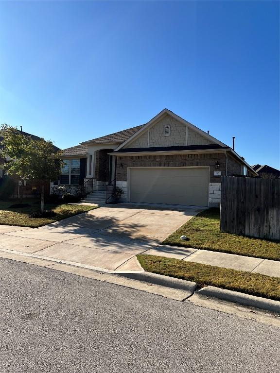 single story home with a garage