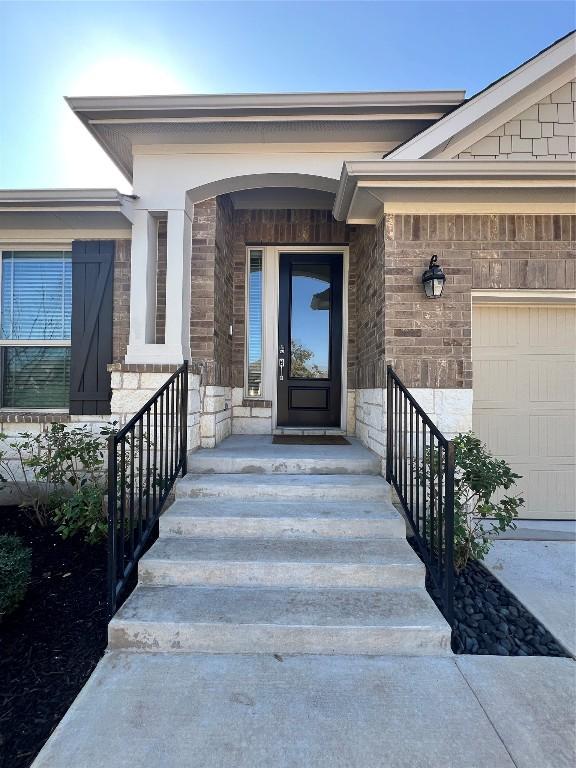 entrance to property featuring a garage