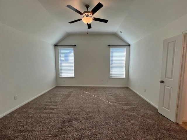 additional living space featuring carpet flooring, plenty of natural light, and lofted ceiling