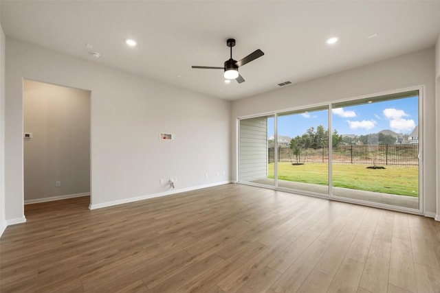 spare room featuring ceiling fan and wood-type flooring