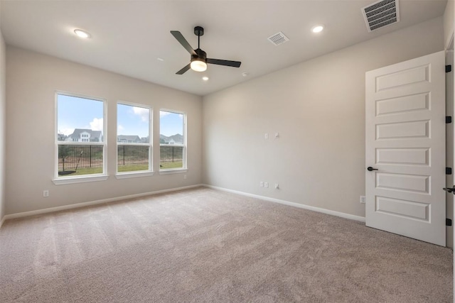 carpeted empty room with ceiling fan