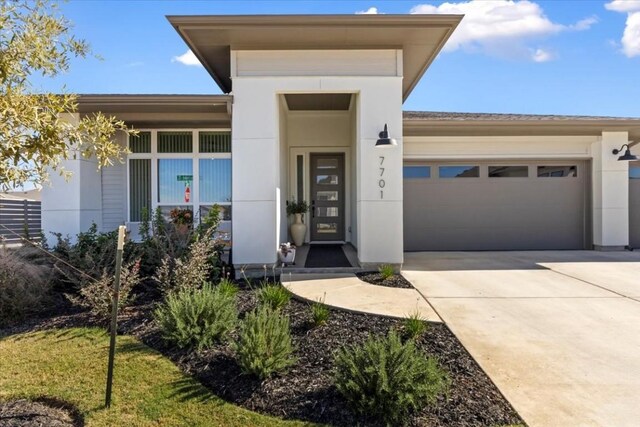 view of exterior entry featuring a garage