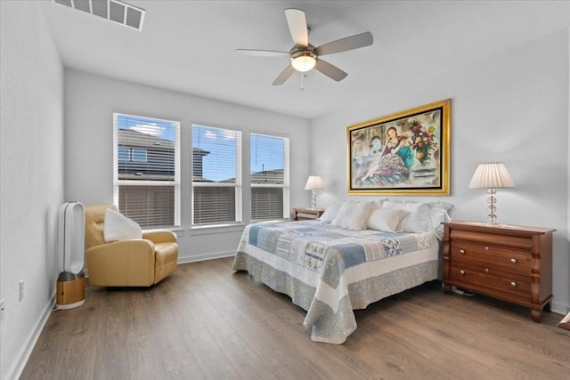 bedroom featuring hardwood / wood-style flooring and ceiling fan