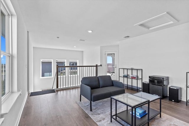 living room with hardwood / wood-style floors and a wealth of natural light