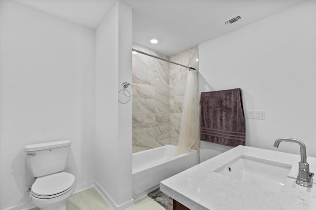 full bathroom with shower / tub combo with curtain, vanity, and toilet