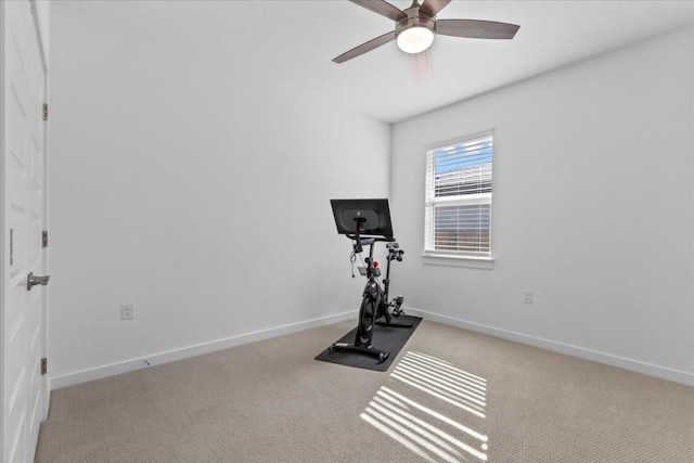 exercise room featuring ceiling fan and light carpet