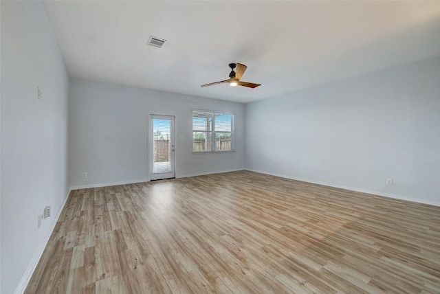 unfurnished room with ceiling fan and light wood-type flooring