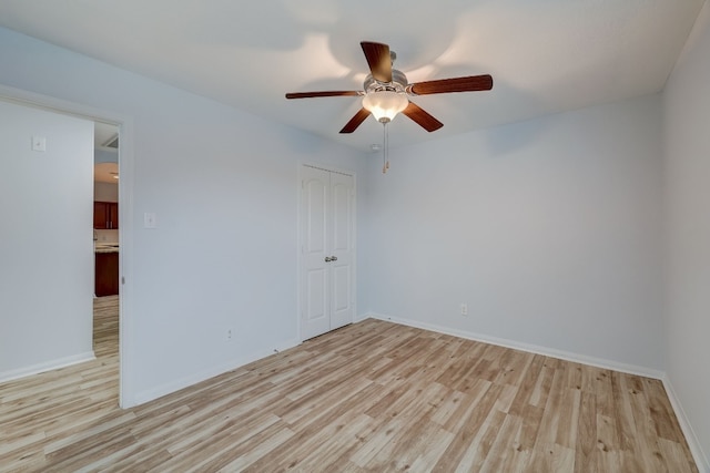 spare room featuring ceiling fan and light hardwood / wood-style floors