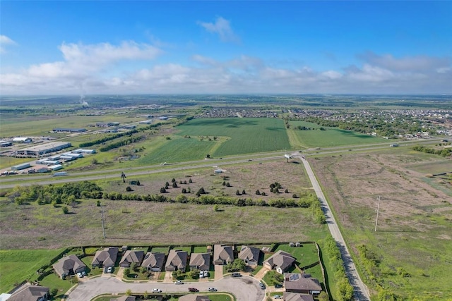 birds eye view of property with a rural view