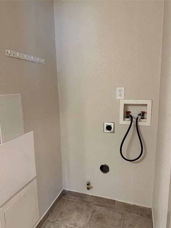 washroom with tile patterned floors, gas dryer hookup, hookup for a washing machine, and hookup for an electric dryer