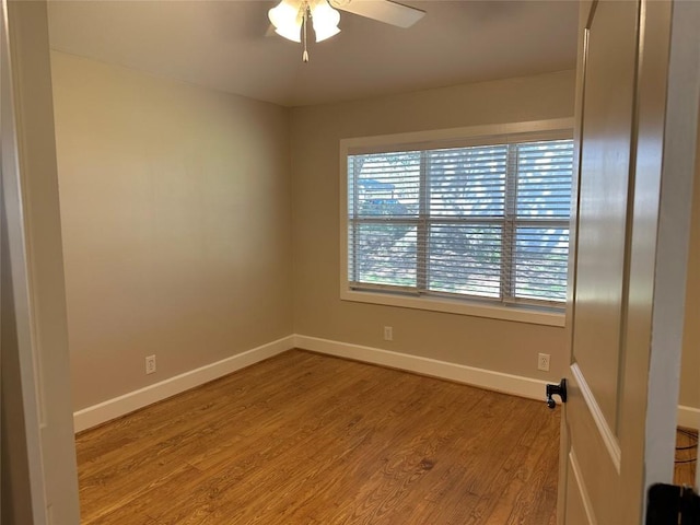 empty room featuring ceiling fan and light hardwood / wood-style flooring