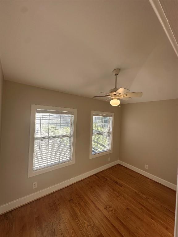 unfurnished room featuring hardwood / wood-style floors and ceiling fan