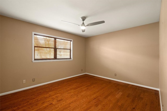 unfurnished room with ceiling fan and hardwood / wood-style floors