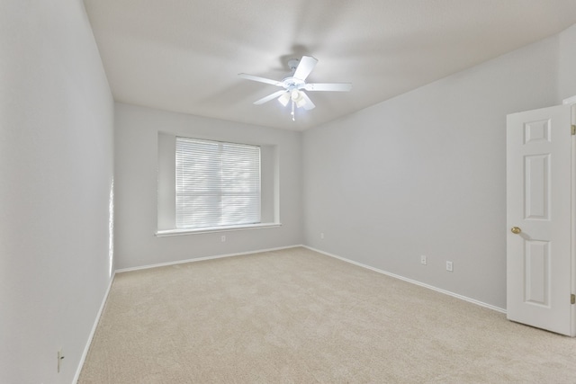 empty room with light carpet and ceiling fan