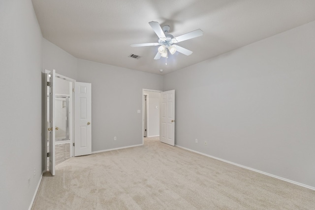 30004 Oakland Hills Dr, Georgetown, TX 78628 - unfurnished bedroom with light carpet, ensuite bathroom, and a ceiling fan