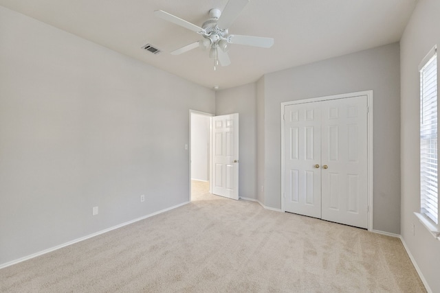30004 Oakland Hills Dr, Georgetown, TX 78628 - unfurnished bedroom featuring carpet flooring, a closet, and multiple windows