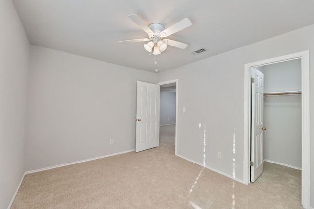 30004 Oakland Hills Dr, Georgetown, TX 78628 - unfurnished bedroom with light colored carpet, a spacious closet, a closet, and ceiling fan
