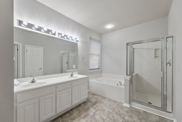 30004 Oakland Hills Dr, Georgetown, TX 78628 - bathroom with a bath, a stall shower, double vanity, and tile patterned floors