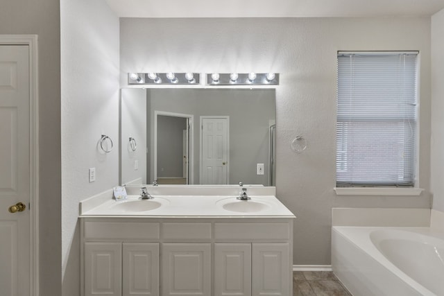 30004 Oakland Hills Dr, Georgetown, TX 78628 - full bath with a bath, double vanity, and tile patterned floors