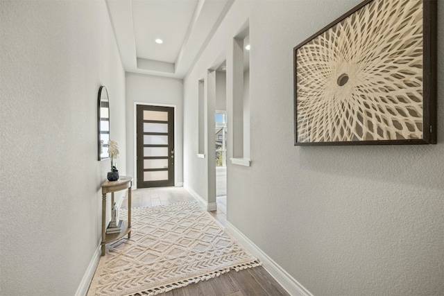 hallway featuring wood-type flooring