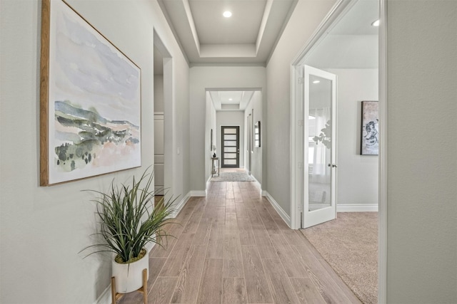 corridor featuring light hardwood / wood-style floors