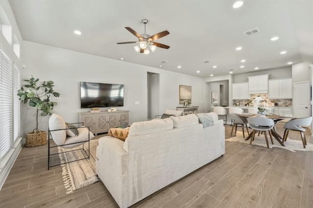 living room with ceiling fan